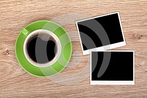 Cup of coffee and two photo frames