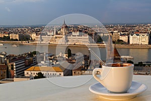 Cup of coffee with a view of the parliament building in Budapest
