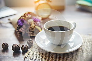 Cup of Coffee with vintage clock and Flower