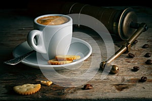 Cup of Coffee with Vintage Grinder, Cookie and Coffee Beans. Turkish Cofee on Old Wooden Table.
