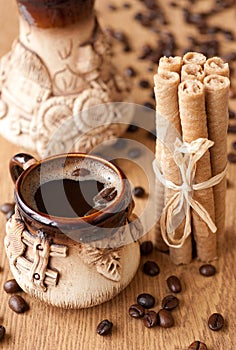 Cup of coffee and wafer rolls