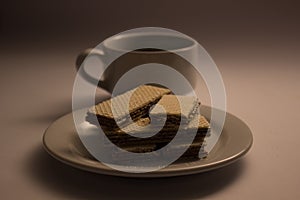 A cup coffee and wafer