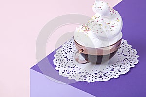 cup of coffee with whipped cream and sprinkles
