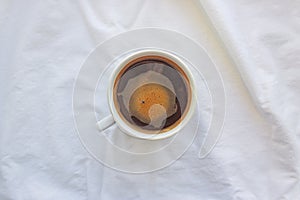 Cup of coffee on white background top view