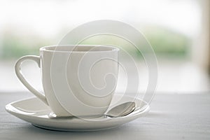 Cup of coffee on white table at coffee cafe.