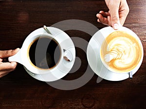 Cup of coffee and woman hand