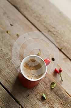 Cup of coffee on a wooden background