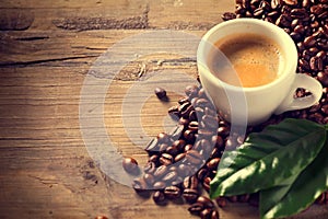 Cup of coffee on wooden background