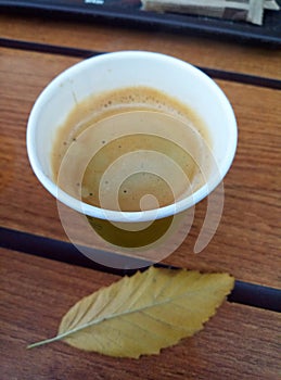 Cup of coffee on wooden table