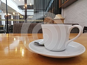 A cup of coffee on the wooden table