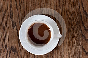 Cup of coffee on wooden table