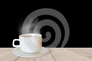 Cup of coffee on wooden table