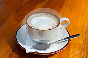 A Cup of coffee on wooden table