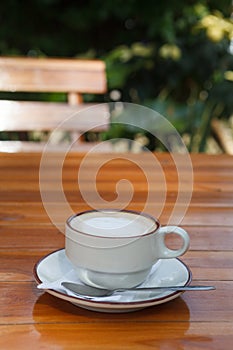 A Cup of coffee on wooden table