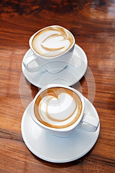 Cup of coffee on wooden table