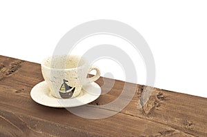 A cup of coffee on a wooden table