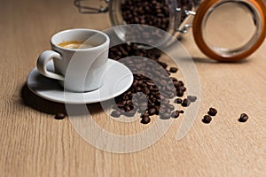 Cup of coffee on a wooden table with natural coffee photo