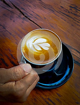 a cup coffeelatte on the wood table
