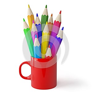 Cup and colored pencils. photo