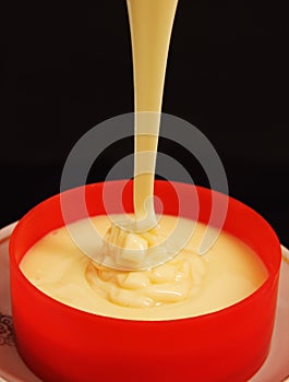 Cup with condensed milk.