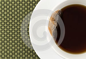 Cup of decaffeinated black tea with tea bag photo