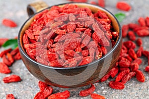 Cup with dried goji berry in close-up. Selective focus, above view