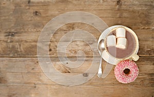 cup with drink coffee cappuccino, hot chocolate, marshmallows, garlands, winter clothes, caffeine improves functioning of human