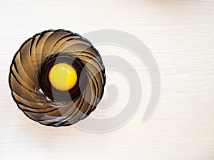 Cup with egg on the table