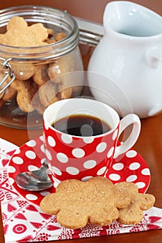 A cup of espresso coffee with butter cookies