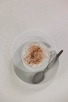 Cup of espresso coffee with saucer and spoon