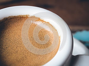 Cup of espresso in morning sunlight