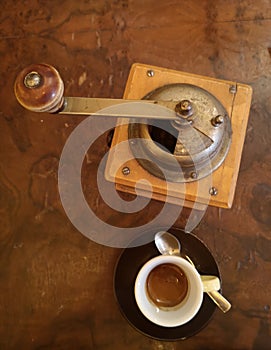 Cup of Espresso and Old Coffee Grinder