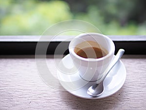 Cup of Espresso. Rustic background.