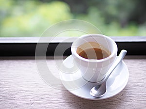 Cup of Espresso. Rustic background.