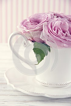 Cup filled with a bouquet of romantic pink roses3