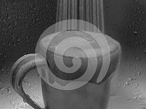 Cup Filling With Flowing Water in Black and White