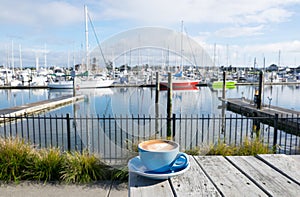 Cup of flat white coffee at Marsden Cove Marina, Whangarei, New photo