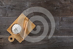 Cup of flour and cutting board