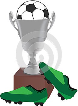 Cup with football and green footballer`s shoes