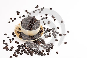 Cup full of coffee beans on on white background
