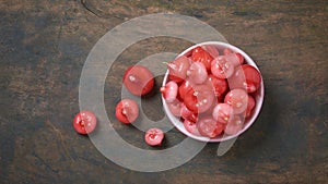 cup full of jambu or rose apple on table top