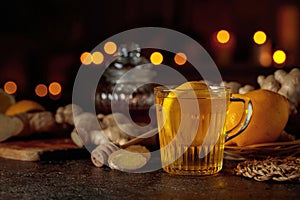 Cup of ginger tea with lemon, honey, and ginger root
