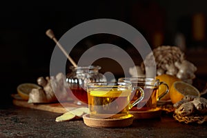 Cup of ginger tea with lemon, honey, and ginger root