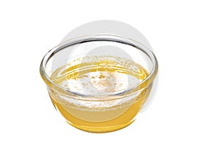 cup of golden melted butter isolated