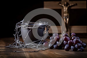 A cup of grape juice with wooden cross and metal Barbed Wire made like the crown of thorns of Jesus on wooden