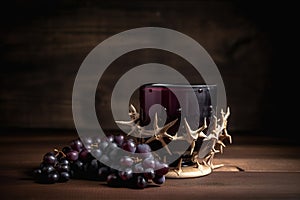 A cup of grape juice with wooden cross and metal Barbed Wire made like the crown of thorns of Jesus on wooden. Generative AI