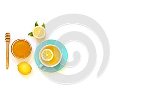 Cup of green tea with lemon and ingredients isolated on white background.