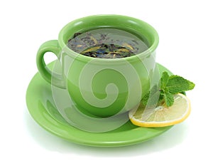 Cup with green tea, with mint and lemon