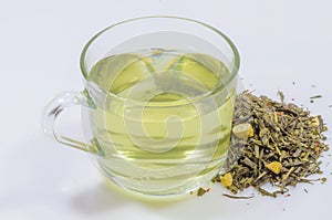 Cup of green tea whit ginseng pieces