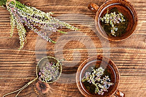 A cup of heather tea on a table